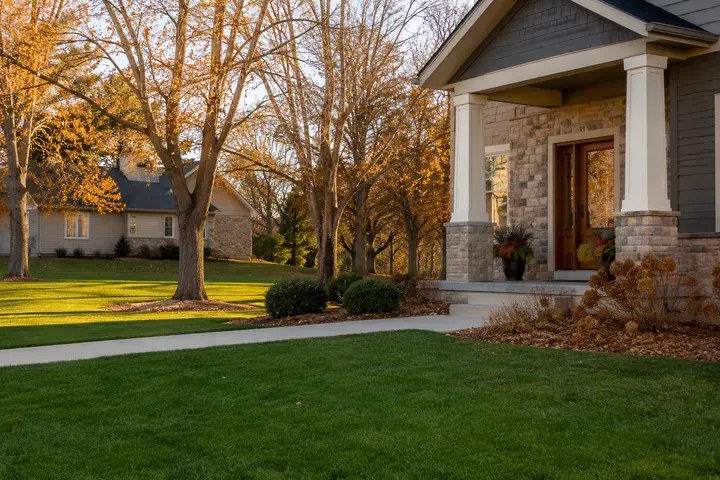 Finished residential lawn after a professional fall clean-up