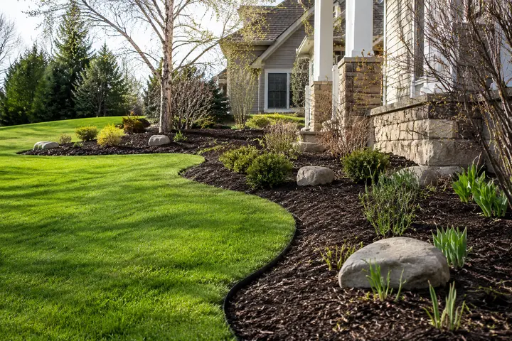 Clean garden bed and lawn edges after spring property cleanup