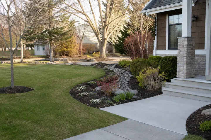 Residential Spring Clean-Up across a Greater Mankato lawn, bed, and walkway